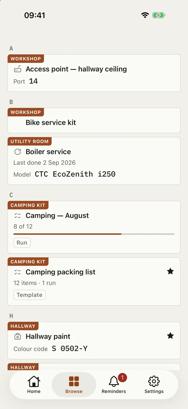 Two Trovva screens in light mode. An A-to-Z of one household, each row labelled with its room: an access point and a bike service kit in the Workshop, a boiler service with its model number in the Utility room, a camping trip and its packing list in the Camping kit, and the hallway paint with its colour code. Beside it, the hallway paint entry itself, with the colour code S 0502-Y and a button that copies it.
